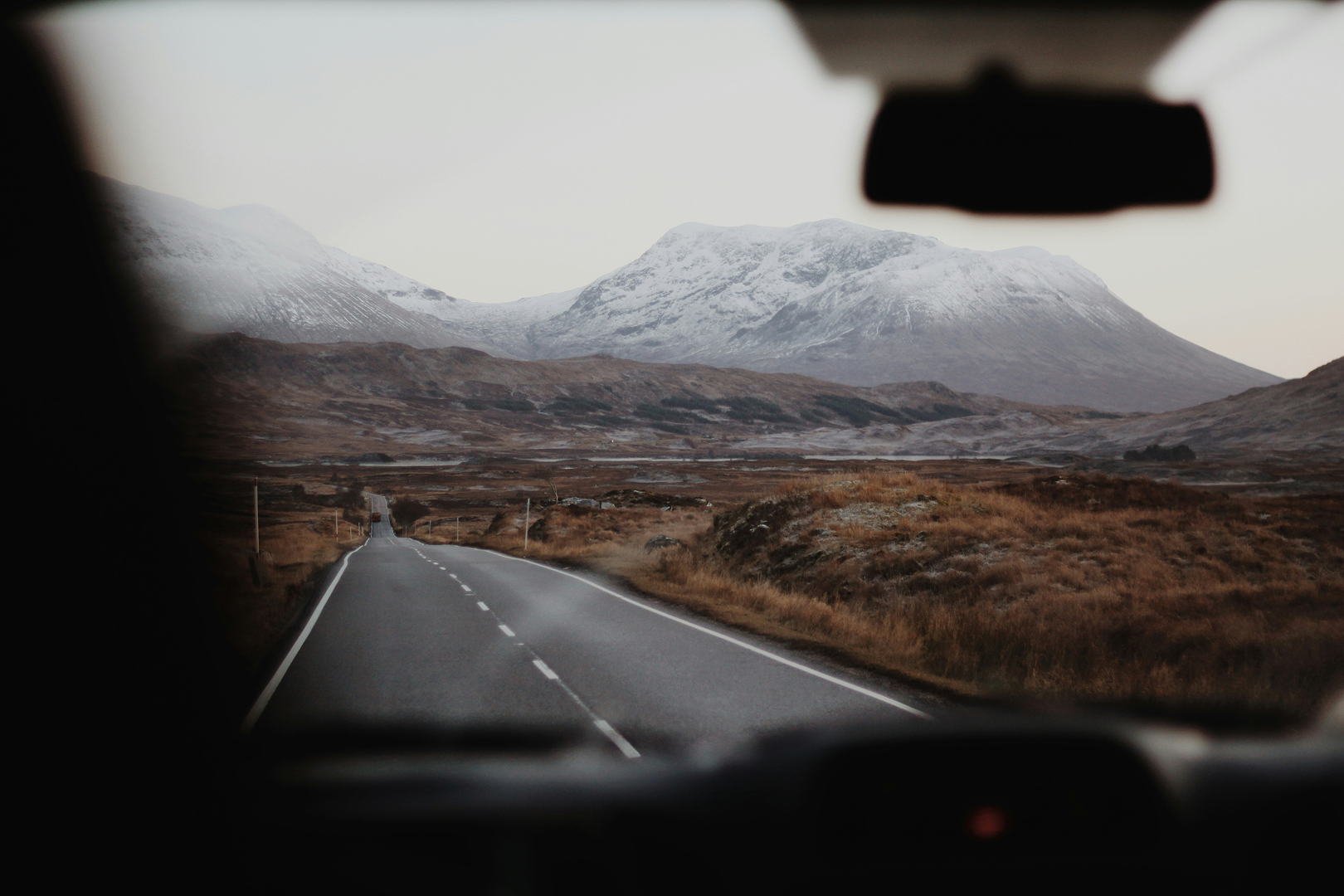 Mountainous point-of-view from a vehicle.