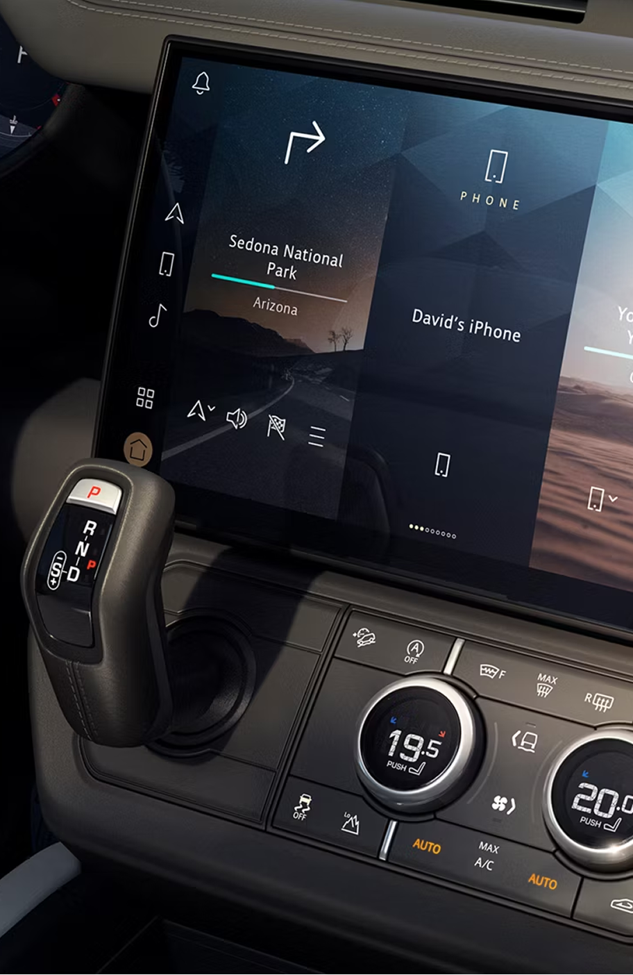 Close-up of the Defender interior infotainment console, showing vehicle battery life.