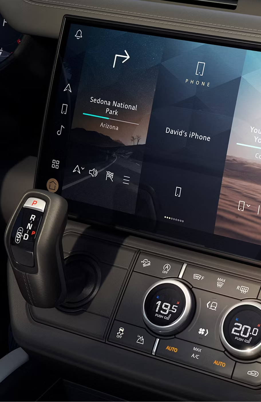 Close-up of the Defender interior infotainment console, showing vehicle battery life.