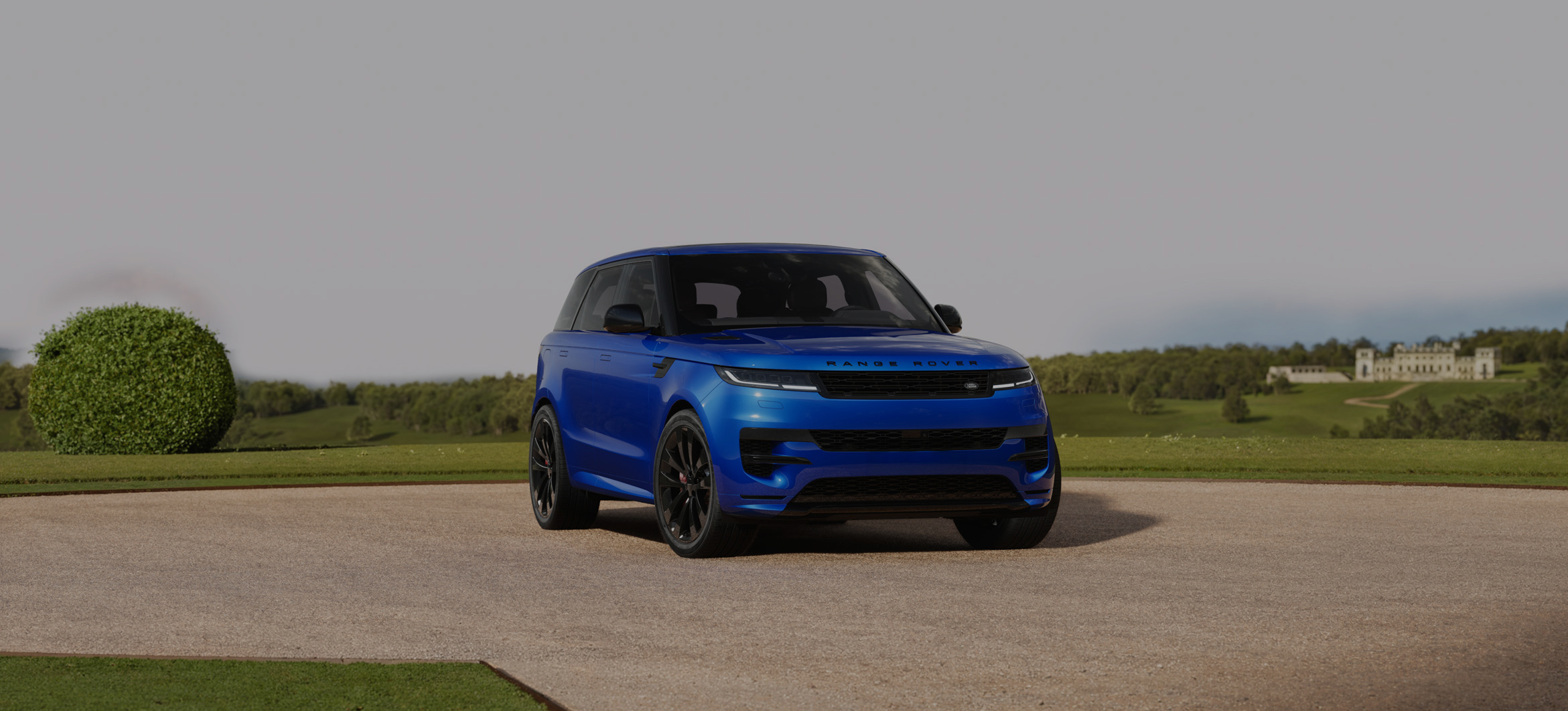 Side view of a Range Rover Sport, with promotional text overlay.
