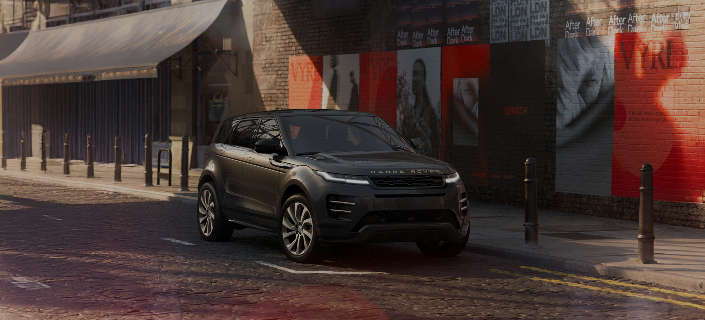 Front view of a black Range Rover Evoque parked in a modern, minimalistic indoor space with promotional text overlay.