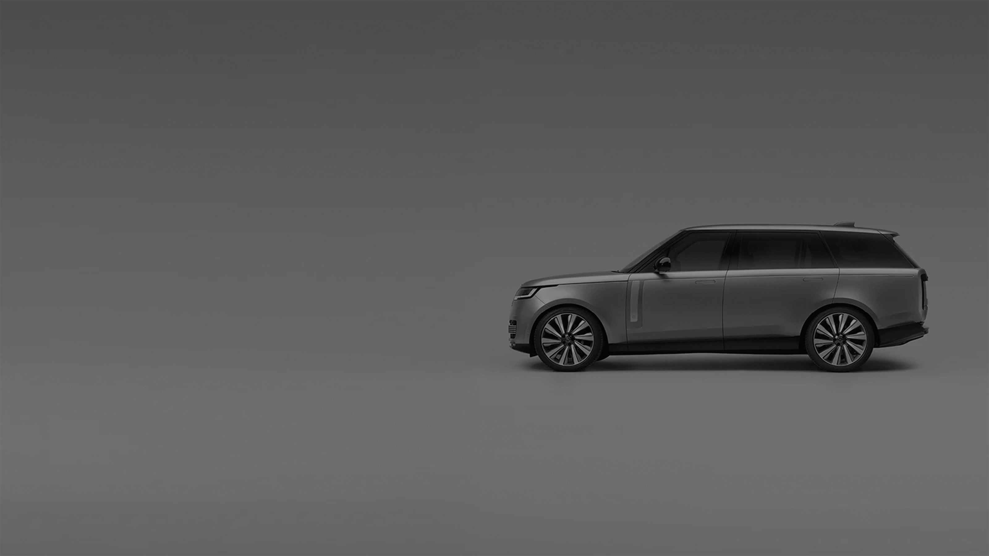 Side view of a Range Rover with promotional text overlay.